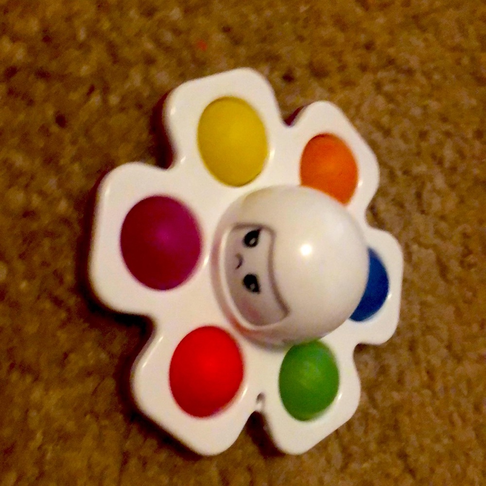 A rainbow changing face simple, dimple, poppet, fidget, spinner